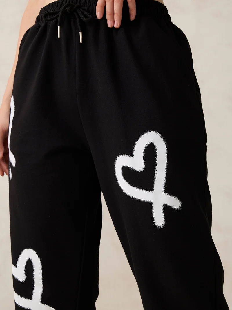 Outzidr  Black Heart Printed Joggers for Women | Best Price UAE